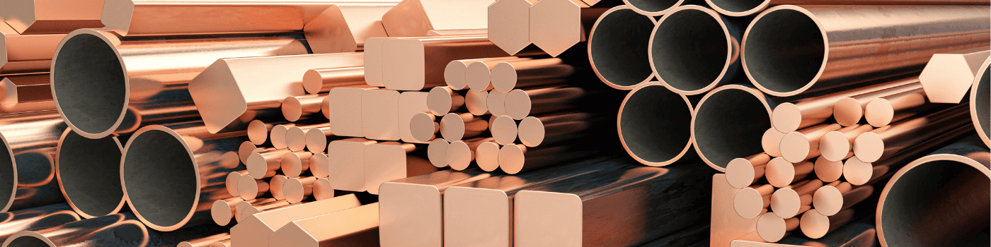 An assortment of copper metal products including bars, tubes, and rods arranged neatly.